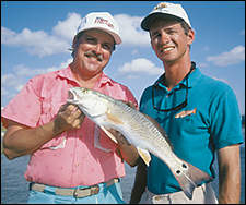 Capt. Pat Murray and TF&G Editor Larry Bozka show off a West Galveston Bay redfish.